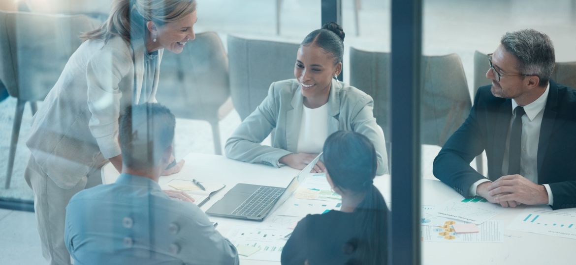 Leader, meeting and presentation with business people behind glass in a finance, data and growth discussion. Teamwork, collaboration and planning with executive team sharing goal, vision and idea